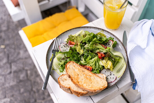 Fresh salad with sourdough and healthy vegetables