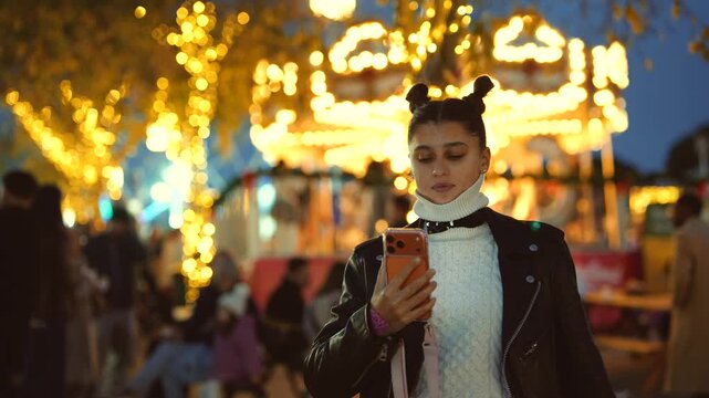 Female recording lively amusement park carousel evening