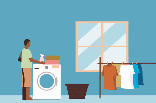 Young man doing laundry with natural sunlight