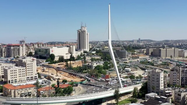 Aerial Chords Bridge Jerusalem Cityscape

Drone footage of the Chords Bridge at the western entrance of Jerusalem with light rail tracks, traffic and surrounding urban architecture, December 24 2025.
