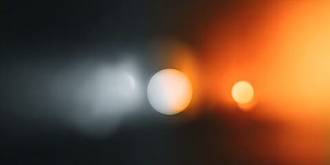 Abstract glowing orbs fade from cool gray to warm orange