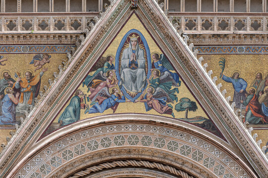 Italy - Orvieto - Duomo di Orvieto - Mosaic tympanum and marble archivolts detail on the Gothic facade