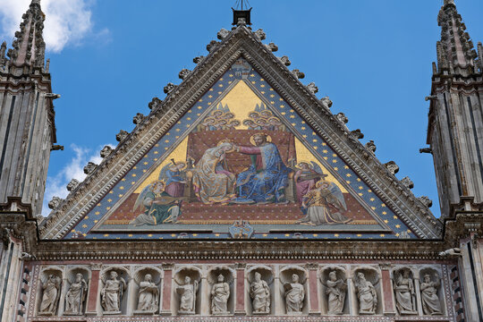 Italy - Orvieto - Duomo di Orvieto - Upper facade detail with mosaic pignon and row of intricate statues