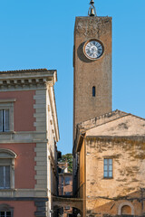 Italy - Orvieto - Torre del Moro - The iconic medieval clock tower standing against a blue sky