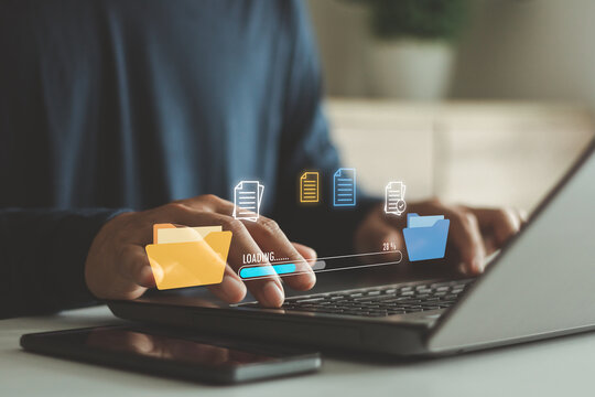 Digital file management concept with person using laptop, showing folder icons and data loading interface for cloud storage, document management, data transfer, backup system and business technology. - Powered by Adobe