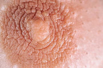 Fototapeta premium Close-up view of textured skin with intricate patterns and a prominent feature, showcasing natural details and the beauty of human anatomy in a captivating manner