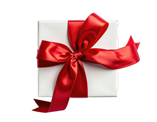 A square white gift wrapped in shiny paper and tied with a large, vibrant red ribbon
