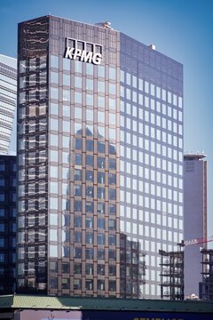 Building exterior and logo or brand or sign of KPMG Italy.