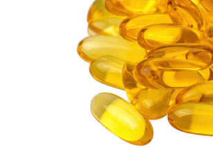 A cluster of transparent, amber-colored soft gel capsules is isolated on a black background