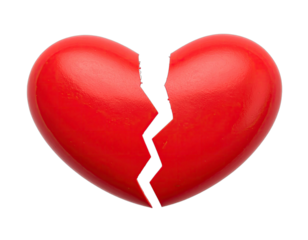 Close-up of a glossy red heart shape broken down the middle on a stark black background