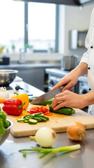 Chef slicing produce in professional kitchen