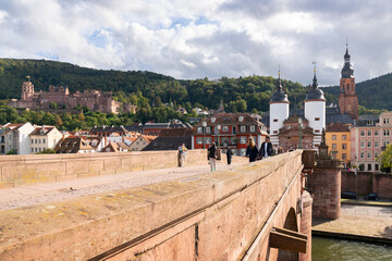 Heidelberg, Germany &ndash; October 1, 2024 Heidelberg Germany Historic Old Bridge with Tourists.Tourists by the Bridge Gate on the Karl Theodor Bridge in Heidelberg, Baden-Wurttemberg, Germany.
