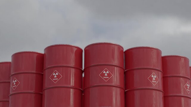 Loop animation of red radioactive waste barrels. Ideal for nuclear energy, environmental risk, safety warnings, industry news, documentaries and hazard concepts. Part of series.