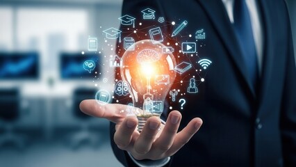 Closeup Businessman Hand holding light bulb with learning and education icons. Concept of knowledge development, digital education, innovative learning, brain training, online course and future skills
