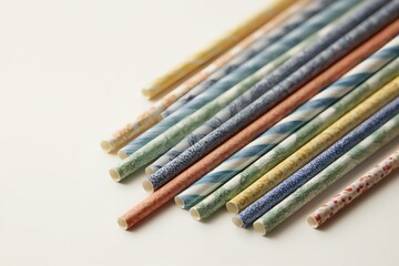 Vibrant Paper Straws: Scattered Delight in Negative Space