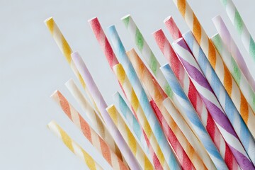 Vibrant Paper Straws: Scattered Delight in Negative Space