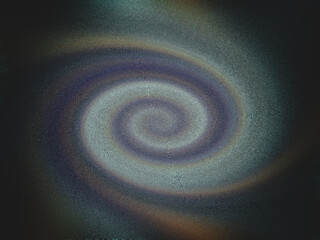 A spiral galaxy with a blue and purple hue