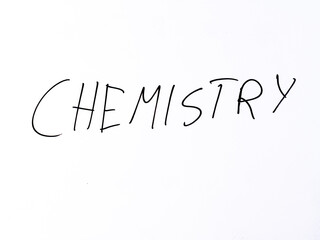 Minimal handwritten word &ldquo;chemistry&rdquo; on a white background. Concept representing scientific study of matter, reactions, and molecular structures.