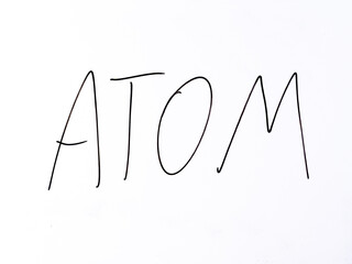 Minimal hand-drawn word &ldquo;atom&rdquo; on a white background. Symbol of the basic unit of matter and foundation of chemical science.