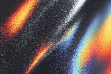 Abstract close-up of a metallic surface with vibrant colors and patterns.