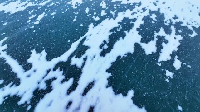 Abstract Winter Landscape - Snow Patches on Frozen Lake Surface.