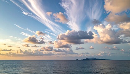 A scenic coastal view showcasing a tranquil ocean expanse under a vibrant sky filled with cloud formations