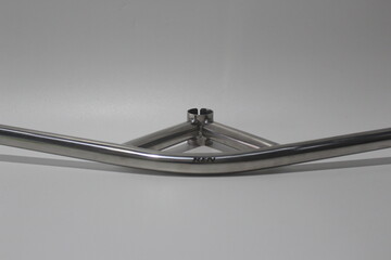 Vintage bullmoose bicycle handlebar made of polished metal, isolated on white background. Classic...