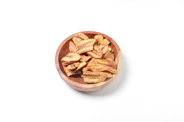 caramel banana chips in a bowl isolated on a white background