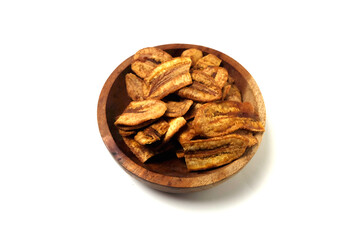 caramel banana chips in a bowl isolated on a white background