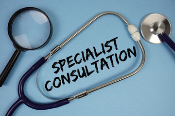 Specialist Consltation text with Stethoscope and magnifying glass on blue background