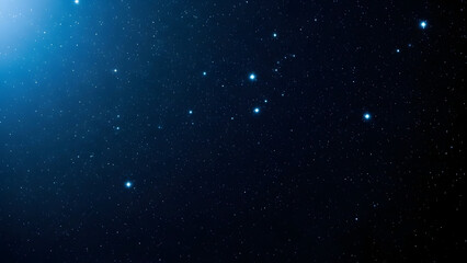 A vast expanse of countless stars twinkle in the deep blue cosmos with a bright nebula glow in the upper left corner
