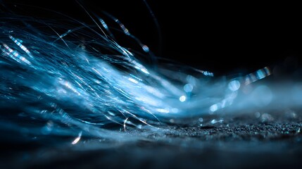 Close-up Macro Shot of Glowing Blue Fibers in Darkness.