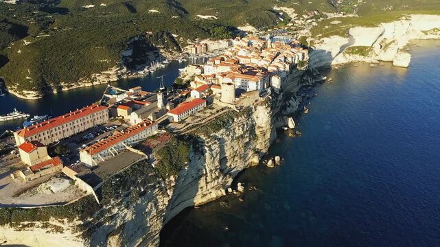 Stunning aerial view of Bonifacio s historic old town perched on dramatic white limestone cliffs overlooking the Mediterranean Sea in Corsica, France.