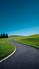 Obraz premium Curved Asphalt Road Through Green Hills Under Blue Sky