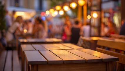 Warm evening ambiance at an outdoor restaurant with blurred patrons enjoying their time under decorative string lights