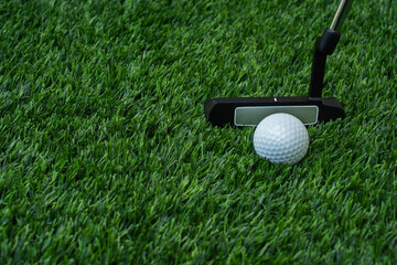 Golfer putter direction to the hole on the green