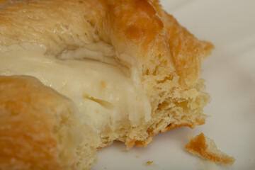 Close up of cream cheese danish with bites taken out