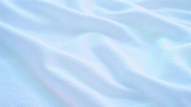 Softly draped white fabric with gentle folds and subtle pastel highlights