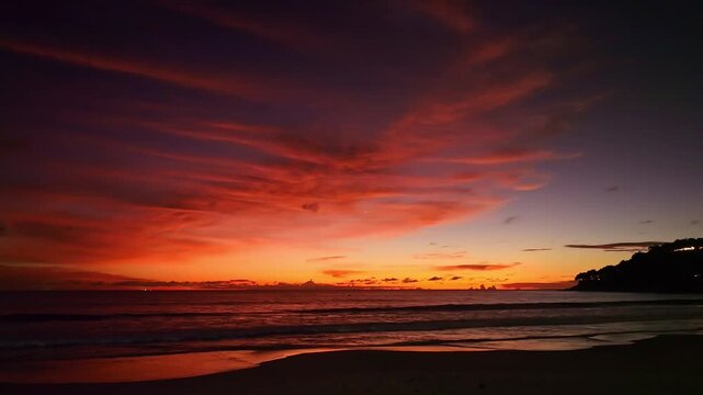 aerial view of exotic sweet sky in sunset at Karon beach Phuket.
Scene of colorful romantic sky sunset with changing the brilliant yellow sky gradually turned red. 
4k video travel concept.
