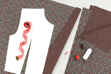 The process of sewing and modeling clothing. Fabric, a paper pattern for a blouse or dress, and a close-up of a measuring tape.
