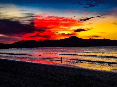 Dramatic Tropical Beach Sunset with Silhouette and Colorful Sky