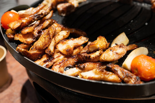 Korean Style BBQ: Sizzling Grilled Beef Entrails with Cherry Tomatoes