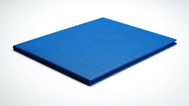 Overhead macro perspective shot of a structured blue document folder landing gently onto a high-key bright white surface bright, paperwork, admin