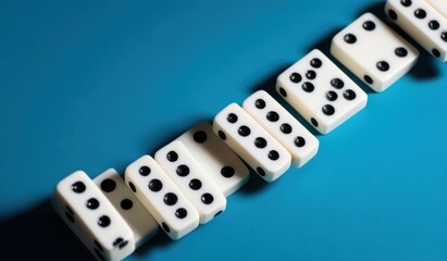 Dice arranged in a diagonal line on a teal background