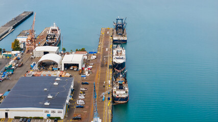 Aerial view of Port of Tacoma ships in a row at loading dock.
