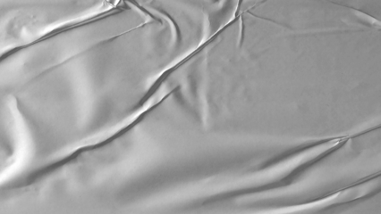 Glued paper texture. Crumpled and wrinkled surface of plain black paper poster background. Wrinkled wet paper