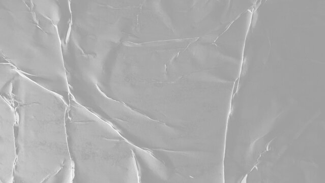 Glued paper texture. Crumpled and wrinkled surface of plain black paper poster background. Wrinkled wet paper