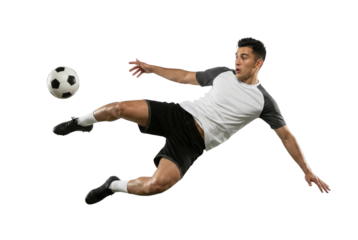 Dynamic Male Soccer Player Kicking Ball Mid-Air Isolated on White