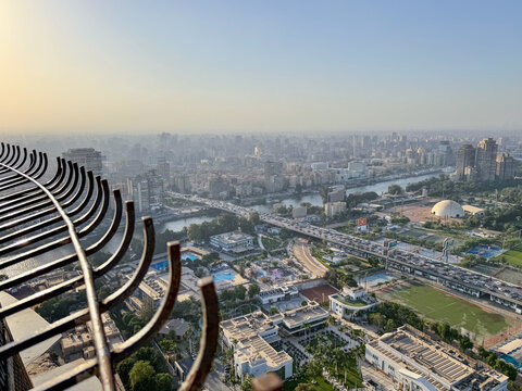 Panoramic city view from Cairo Tower observation deck with safety railing