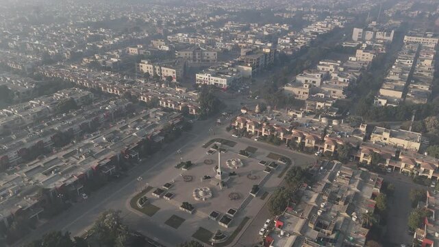 Aerial shot of Bahria Town Lahore at sunrise. Aerial Drone View Of Rows Of Modern Houses Bahria Town Drone view of Bahira town Lahore Pakistan Bahria Town Main Entrance Gate Aerial of the Bahria Town
